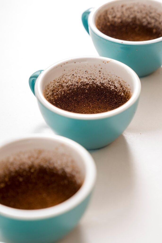 three natural deodorizers baking soda charcoal coffee grounds arranged neatly in refrigerator