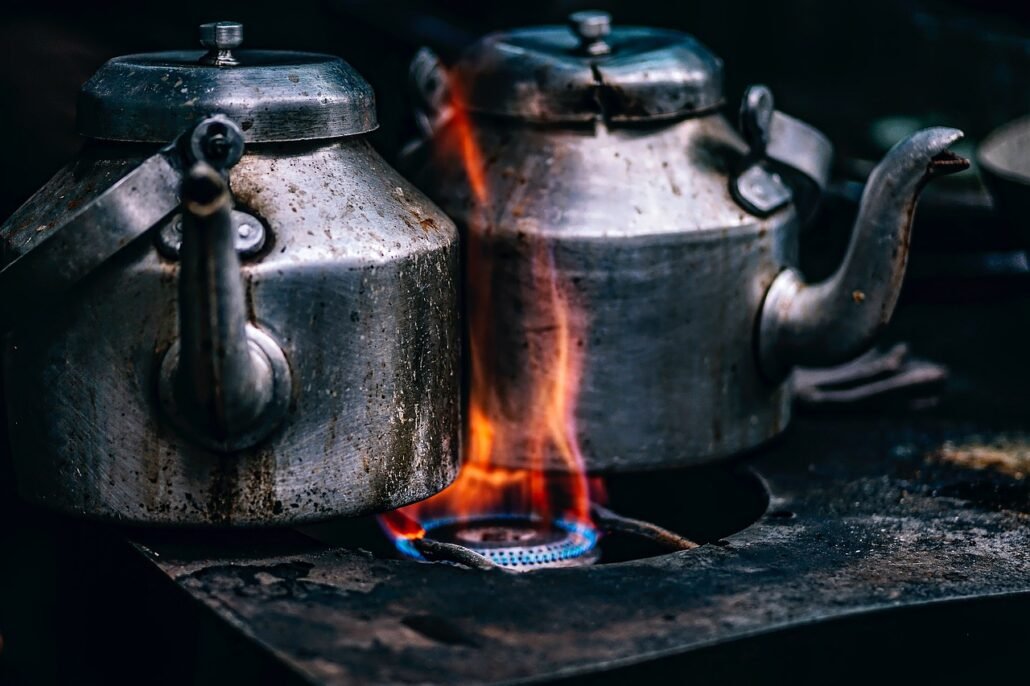 gas stove burner with uneven yellow flame